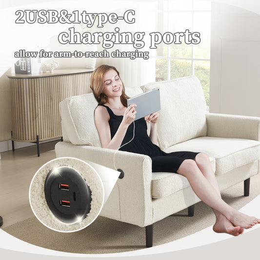 Cream boucle sofa with integrated USB charging ports and a woman using a tablet
