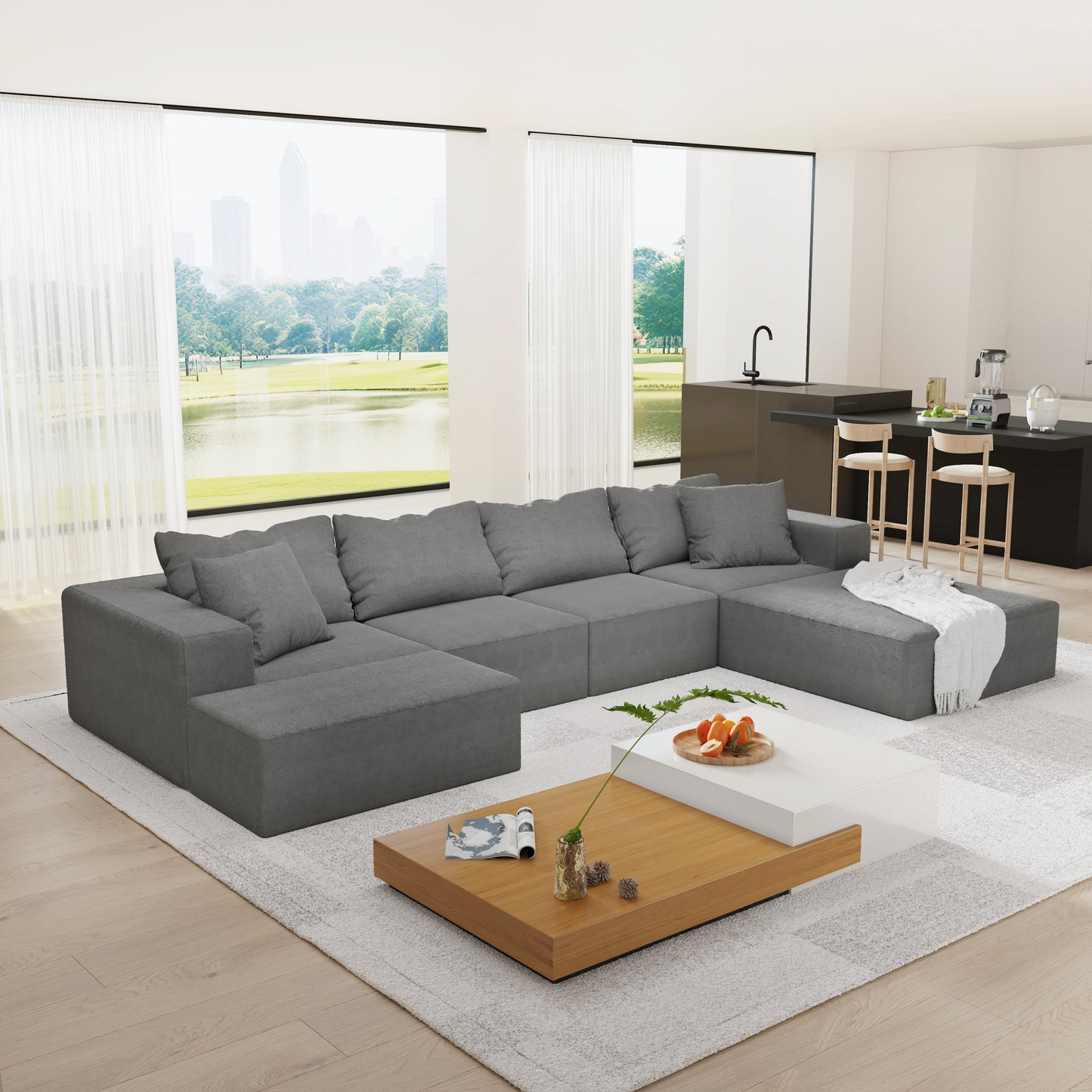 Spacious sectional sofa in charcoal grey fabric featuring deep seating and plush cushions for ultimate comfort and relaxation