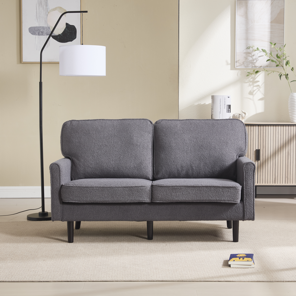 Gray textured fabric loveseat with wooden legs perfect for small living spaces