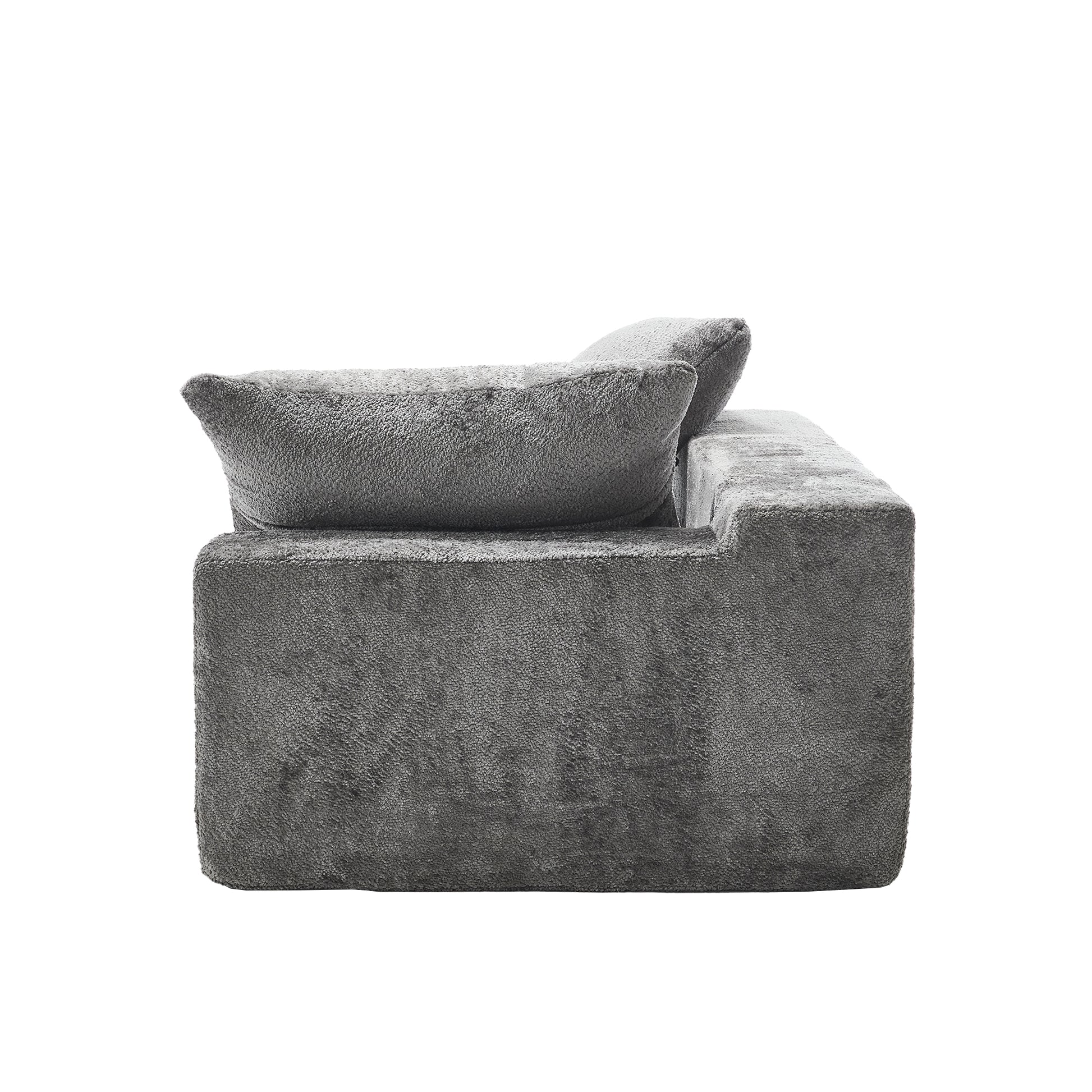 Plush grey sectional sofa with textured fabric and comfortable throw pillows