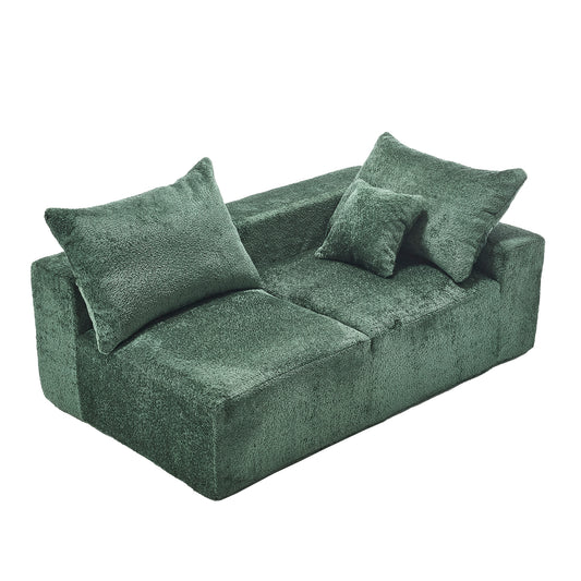Plush green modular sofa with matching throw pillows for modern living rooms