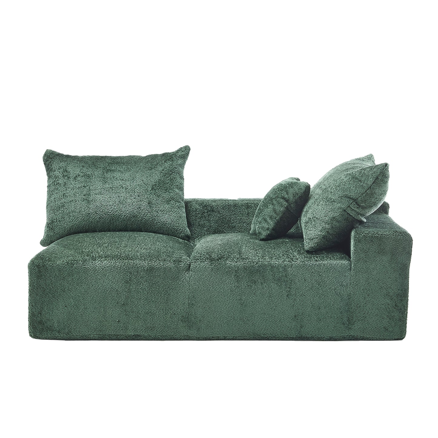 Plush green velvet couch with four throw pillows for modern living rooms