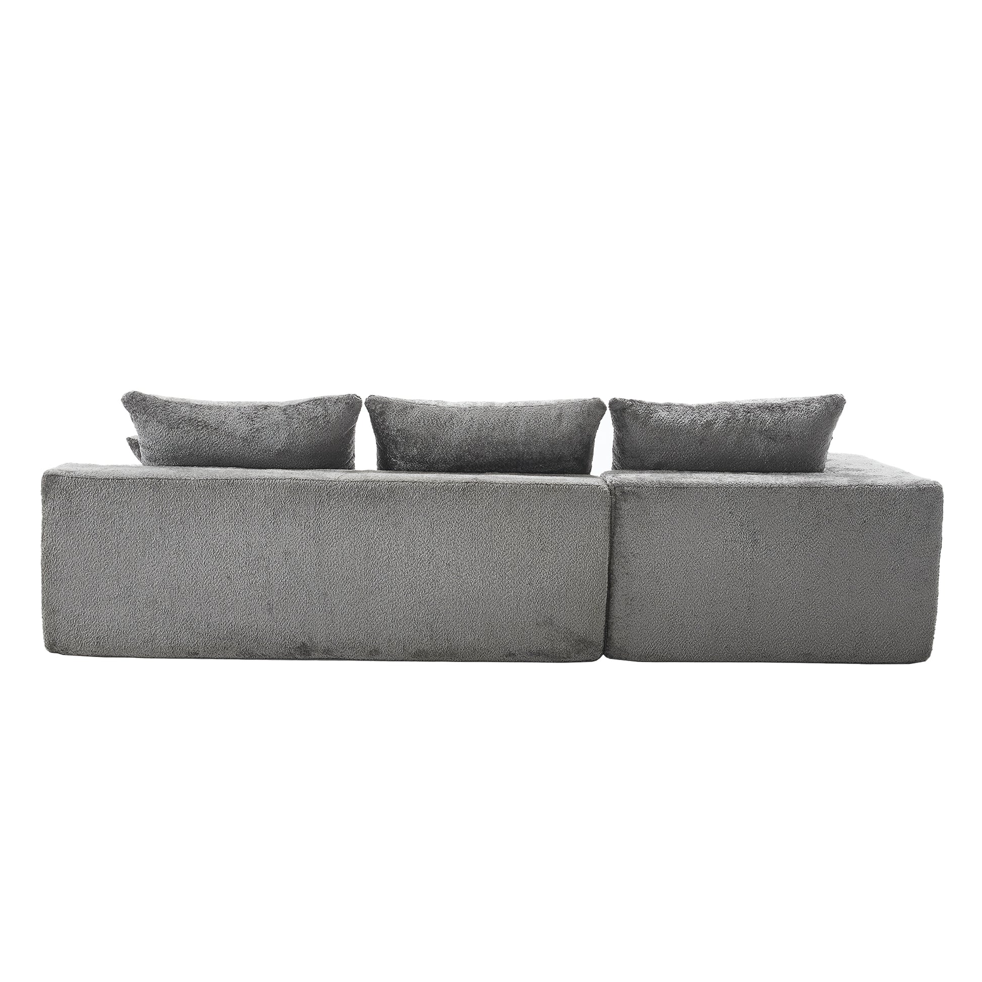 Modern grey boucl sectional sofa with three matching throw pillows perfect for living room seating