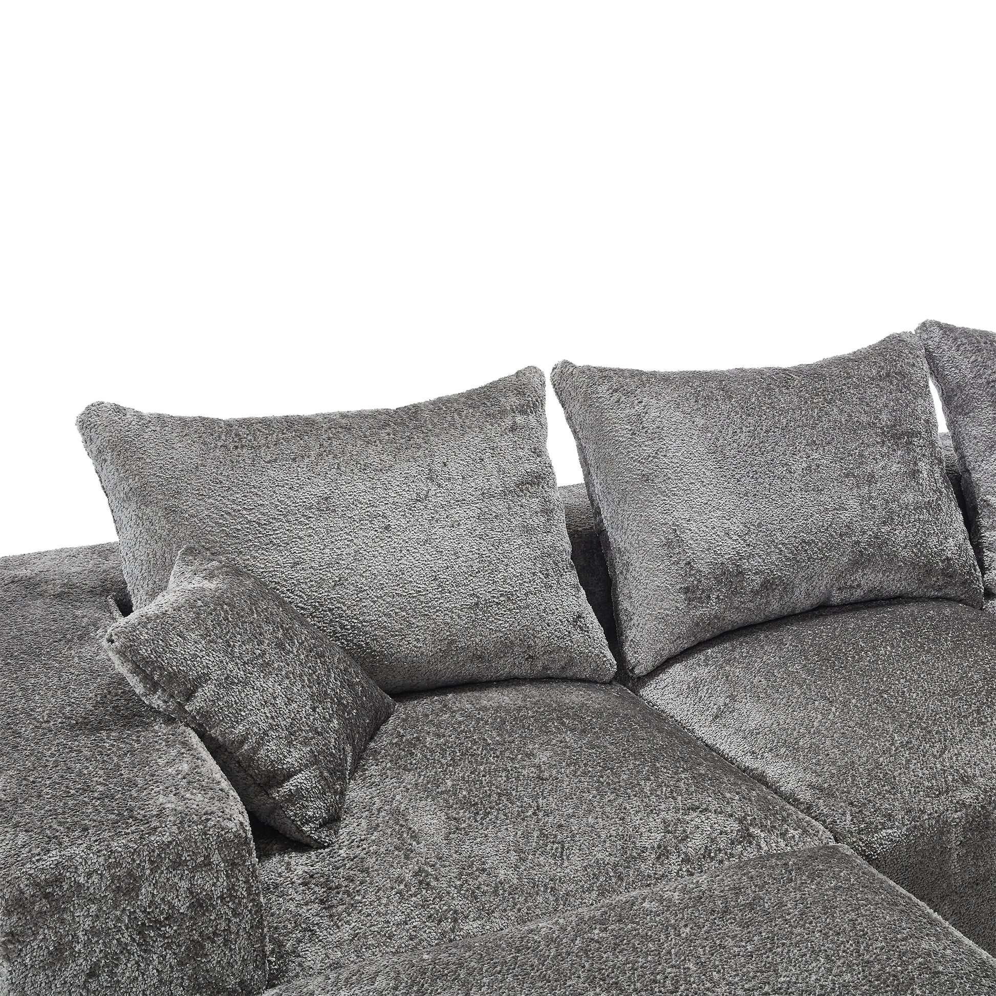 Plush gray sectional sofa with textured fabric and accent pillows perfect for modern living rooms