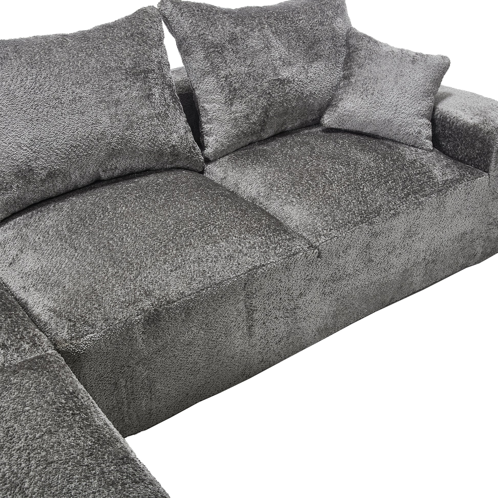 Gray textured fabric sectional sofa with plush throw pillows