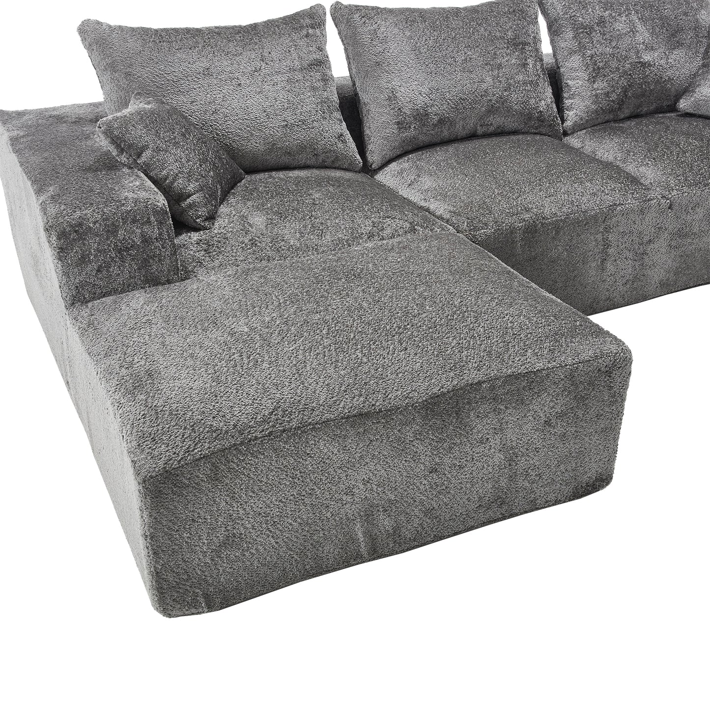 Plush grey modular sofa with deep seats and matching throw pillows