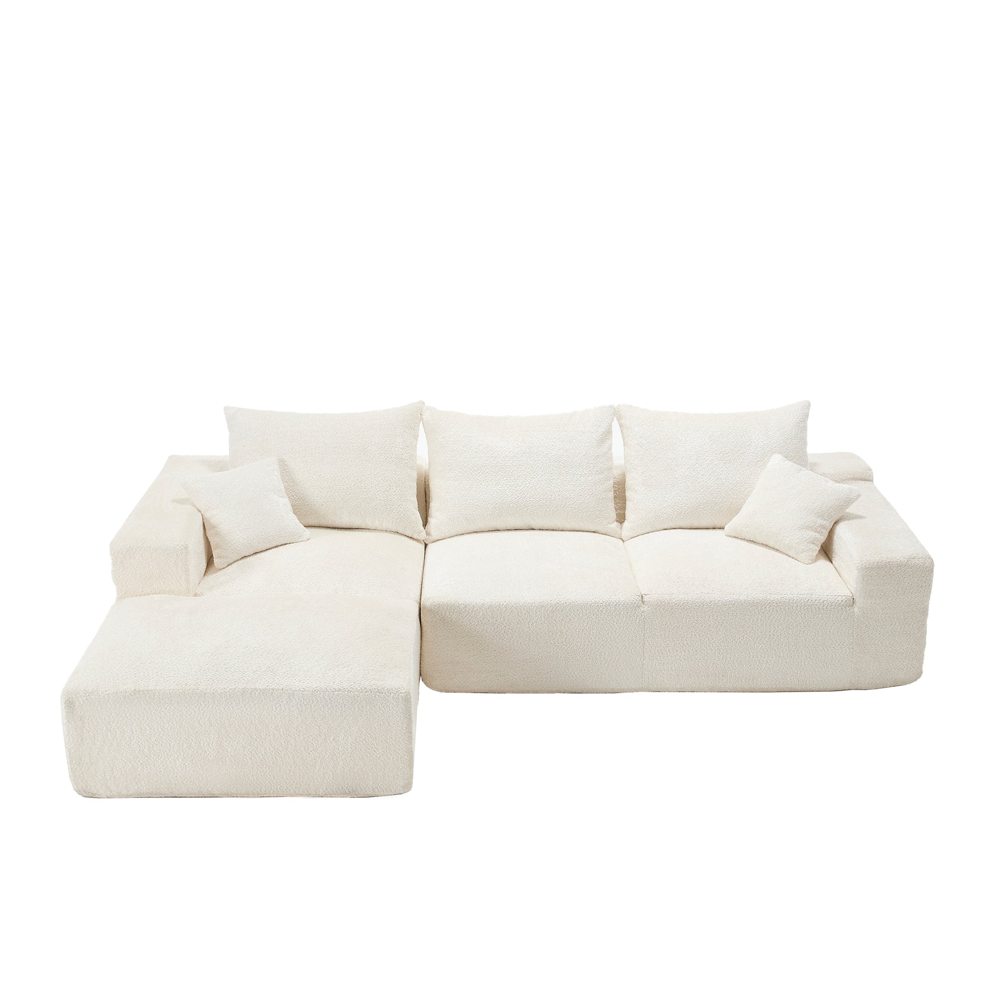 Plush cream boucle sectional sofa with chaise lounge and accent pillows for a cozy living room