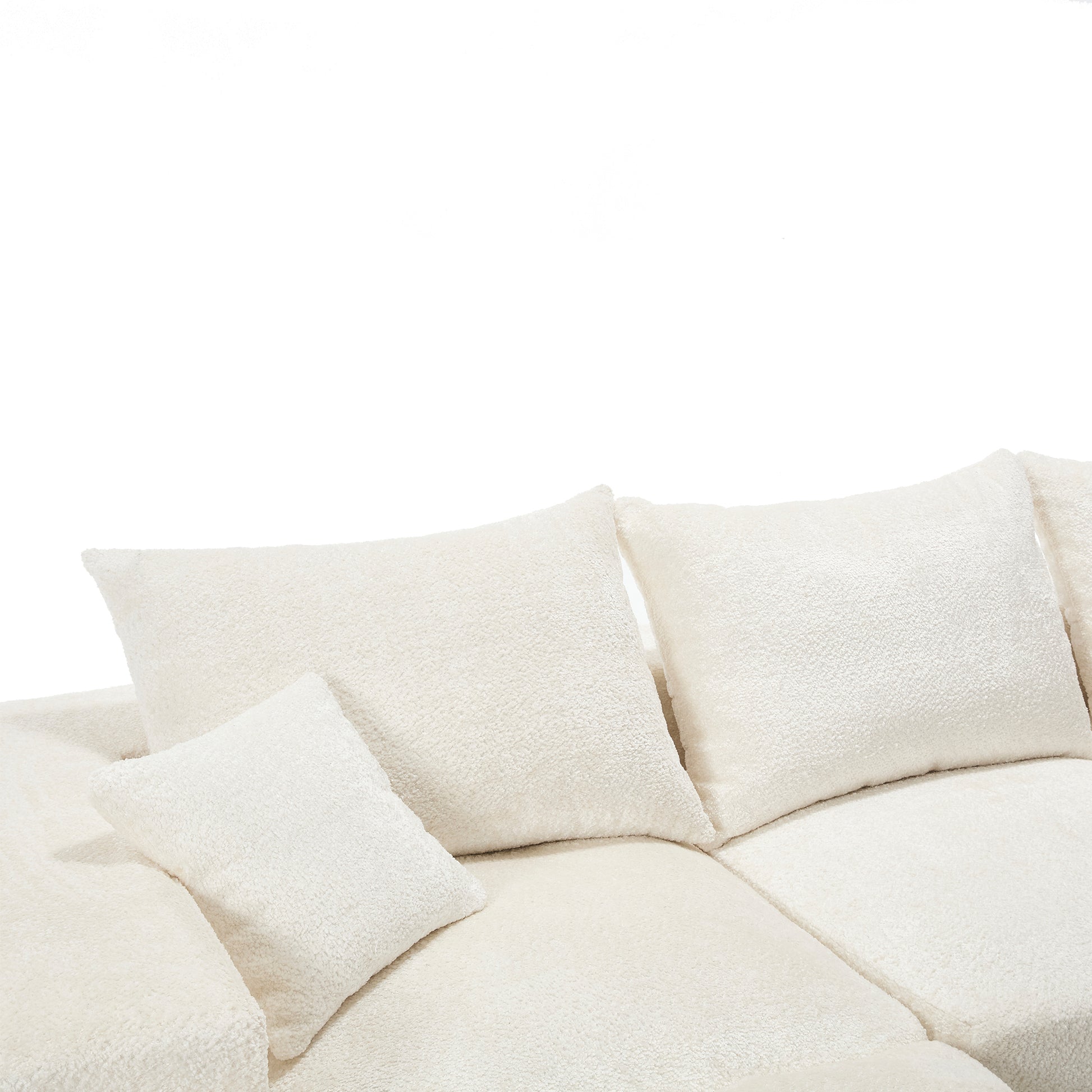 Cozy cream boucle fabric sofa with plush throw pillows for ultimate comfort