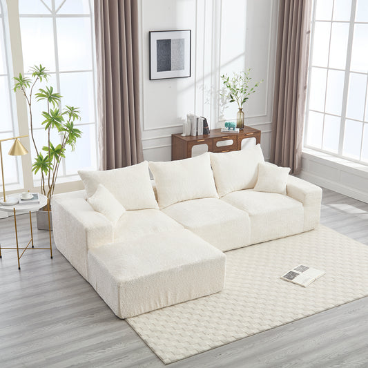Plush white sectional sofa with textured fabric and square arms in a modern living room setting