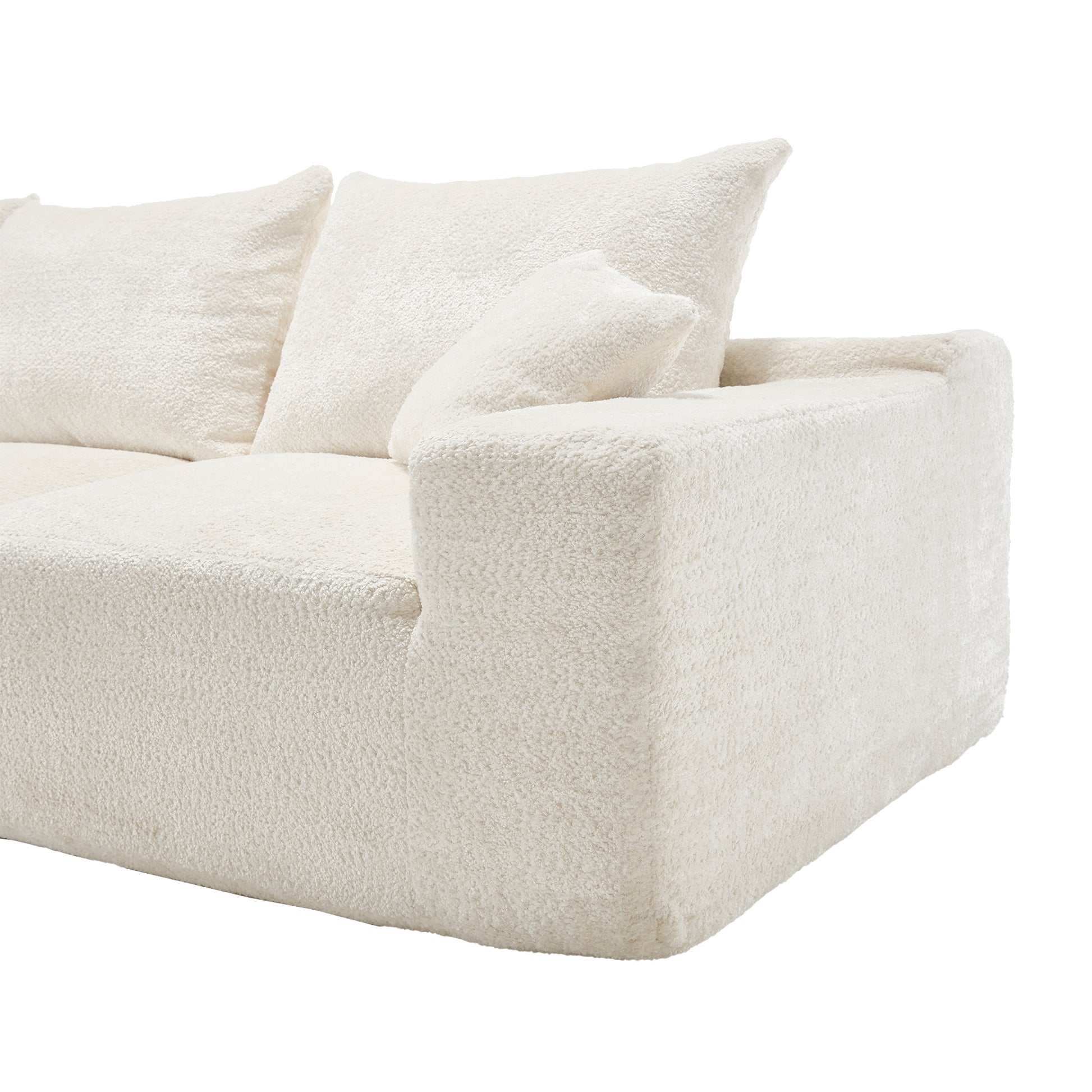 Plush cream boucl sectional sofa with deep inviting cushions for a modern living room