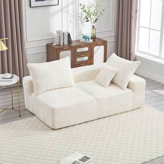 Plush ivory boucle sectional sofa with matching throw pillows for cozy living rooms