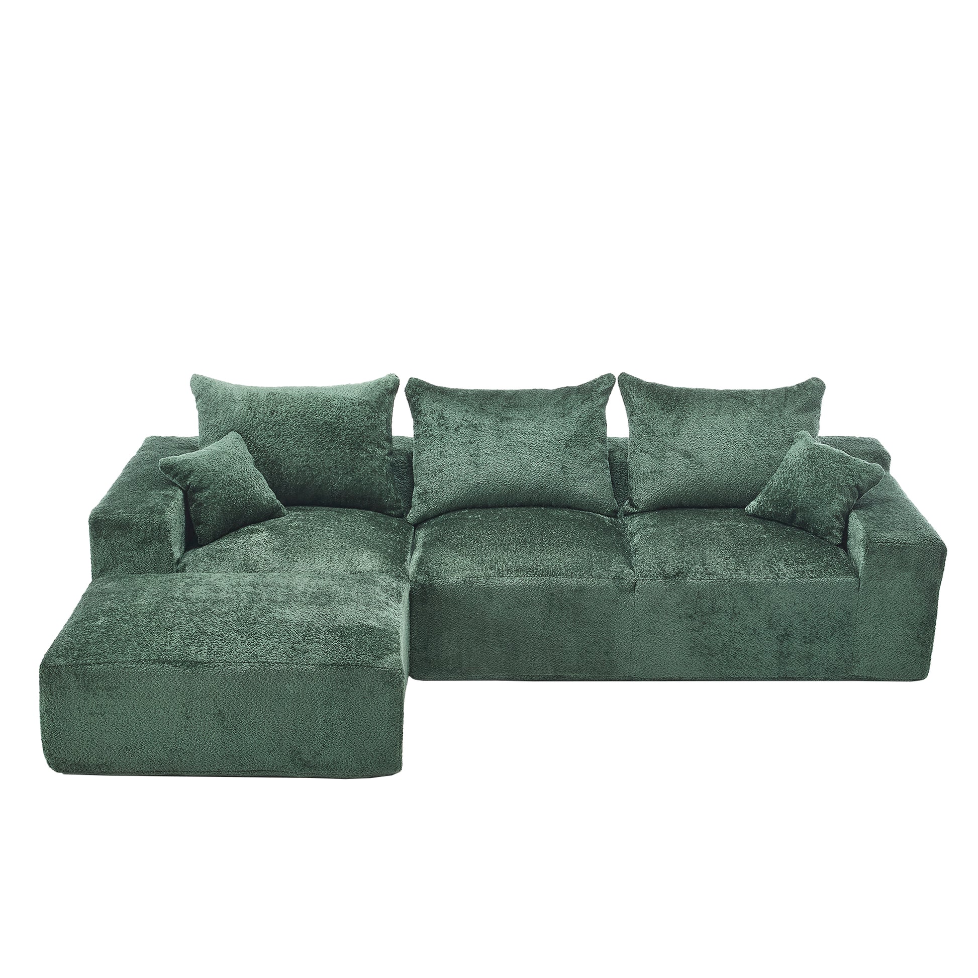Deep green velvet sectional sofa with plush cushions and chaise lounge