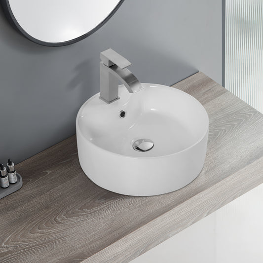 White ceramic vessel sink with modern brushed nickel waterfall faucet