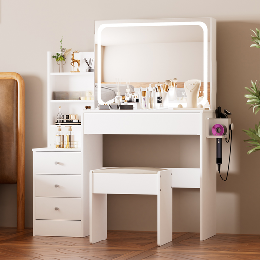 White vanity with lighted mirror and makeup brushes