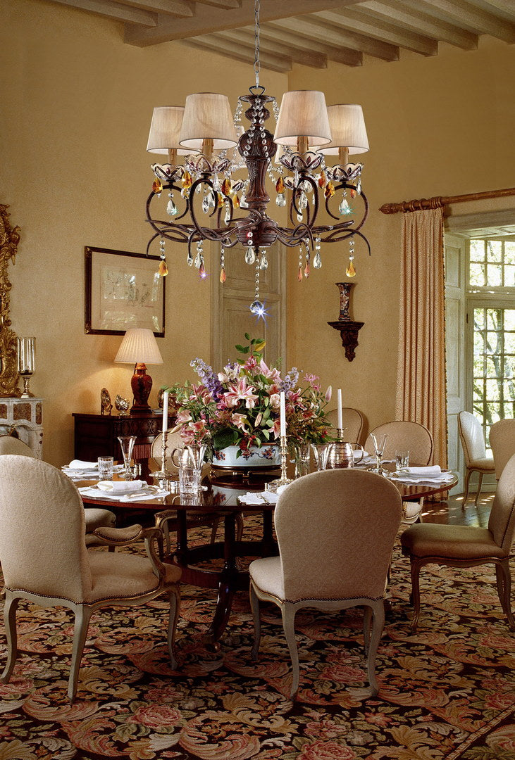 Elegant wrought iron chandelier with crystal accents and cream fabric shades