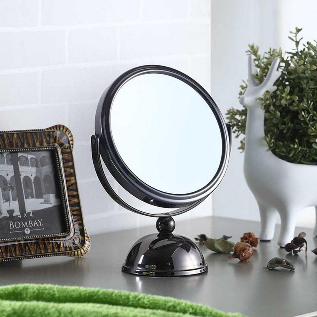 Black metal magnifying makeup mirror with adjustable pivot ideal for vanity