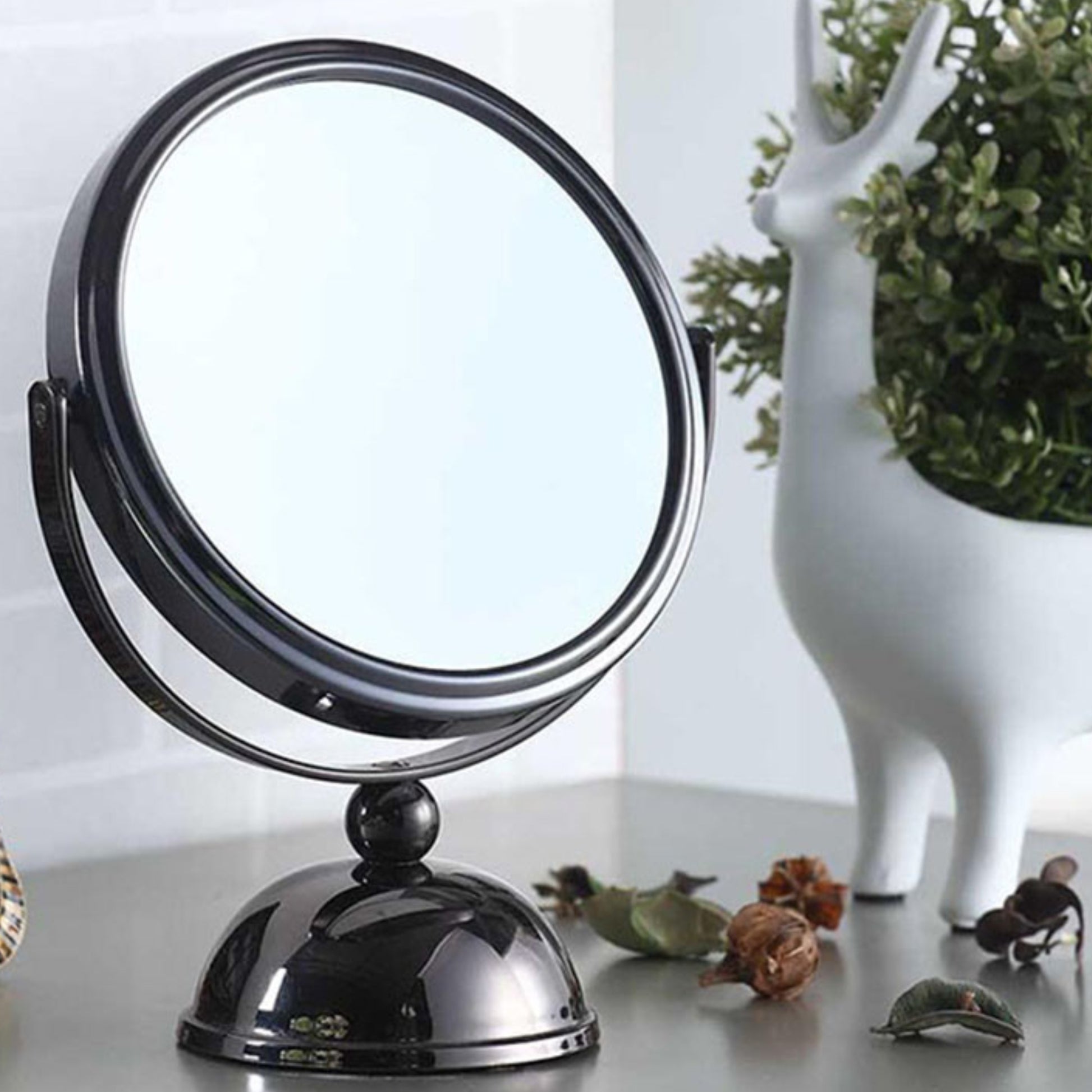 Black metal tabletop vanity mirror with adjustable dualsided swivel for makeup application
