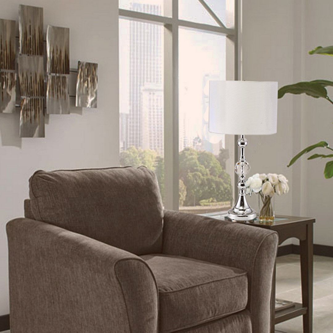 Modern chrome table lamp with crystal accents and white drum shade