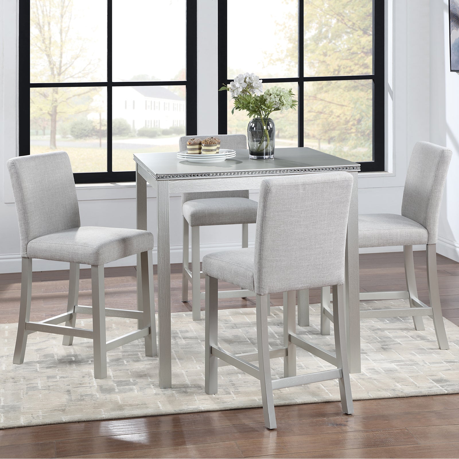 Gray upholstered bar stool with light wood frame