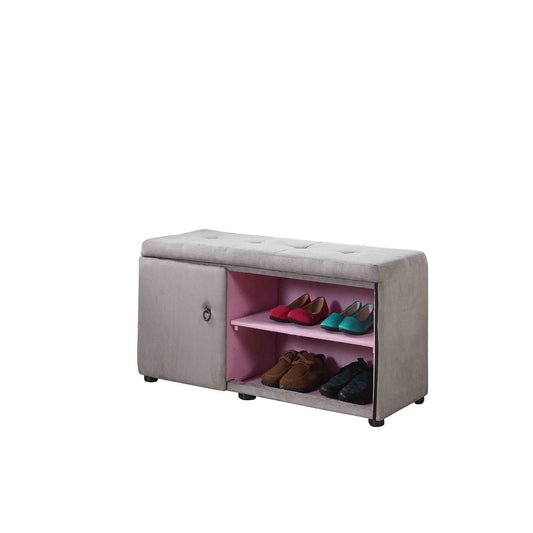 Gray tufted storage bench with a sliding door revealing pink shelves holding red blue and brown shoes
