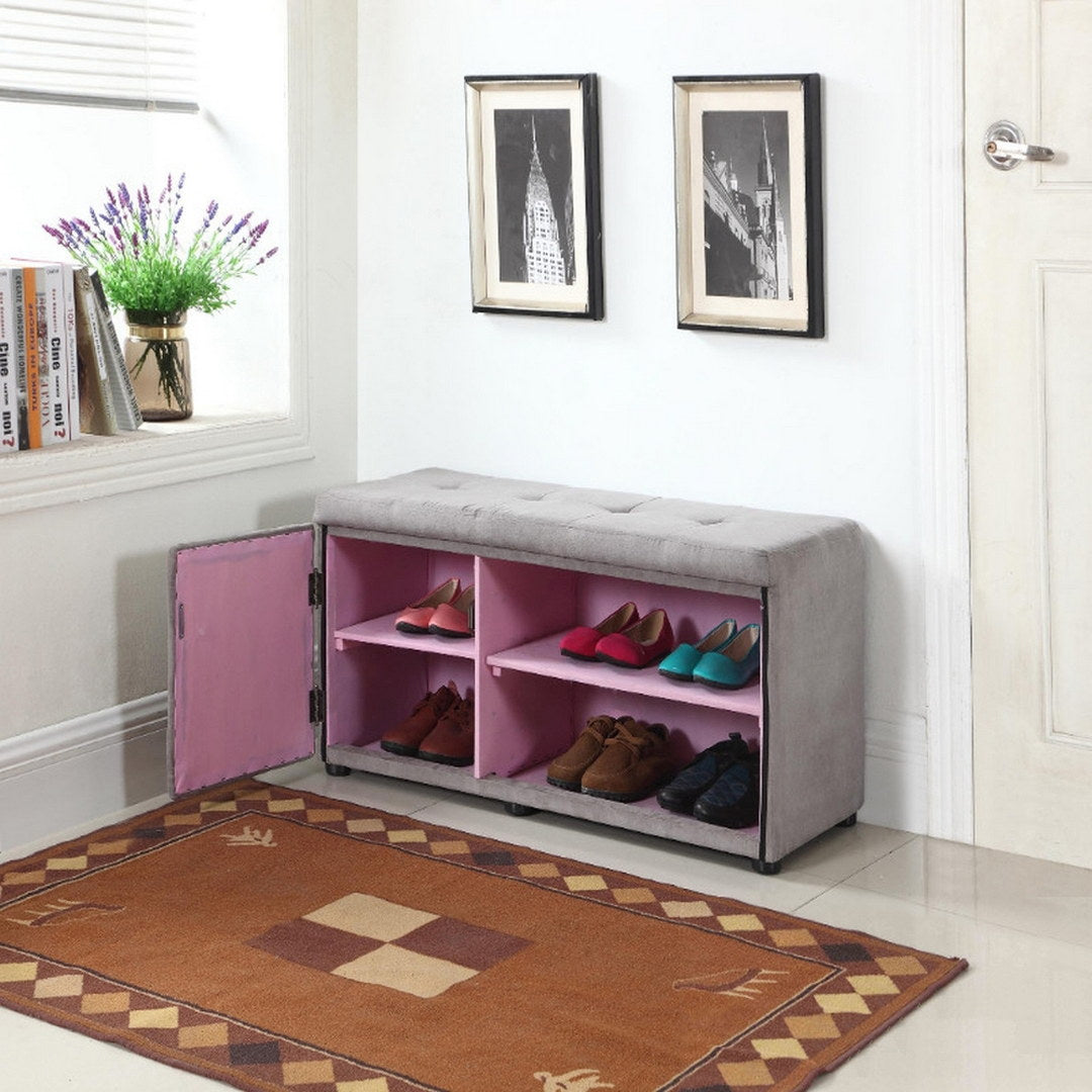 Grey tufted bench with pink interior shoe storage shelves displaying various womens heels