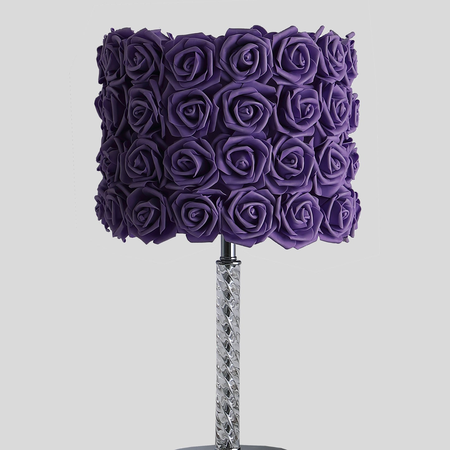 Purple rose lamp with a chrome twisted base adds romantic flair