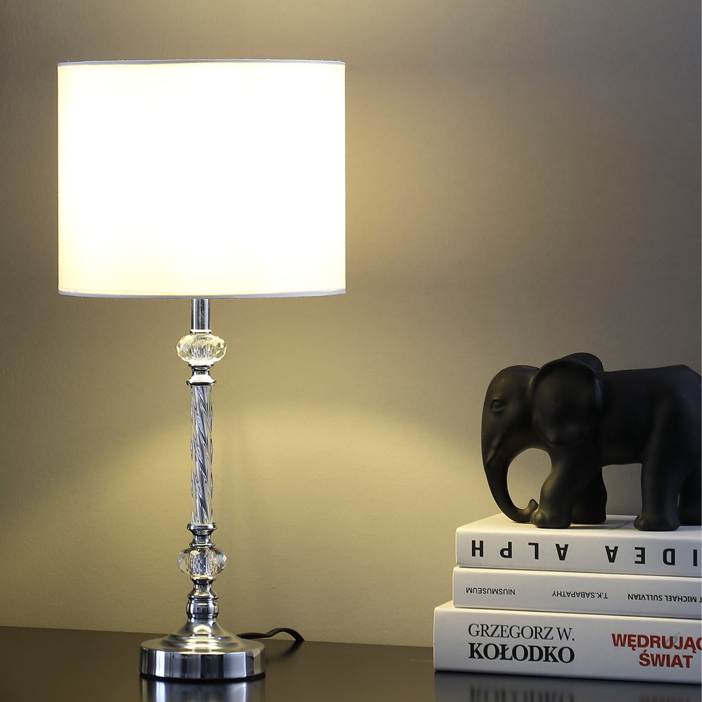 Modern chrome table lamp with crystal accents and white drum shade