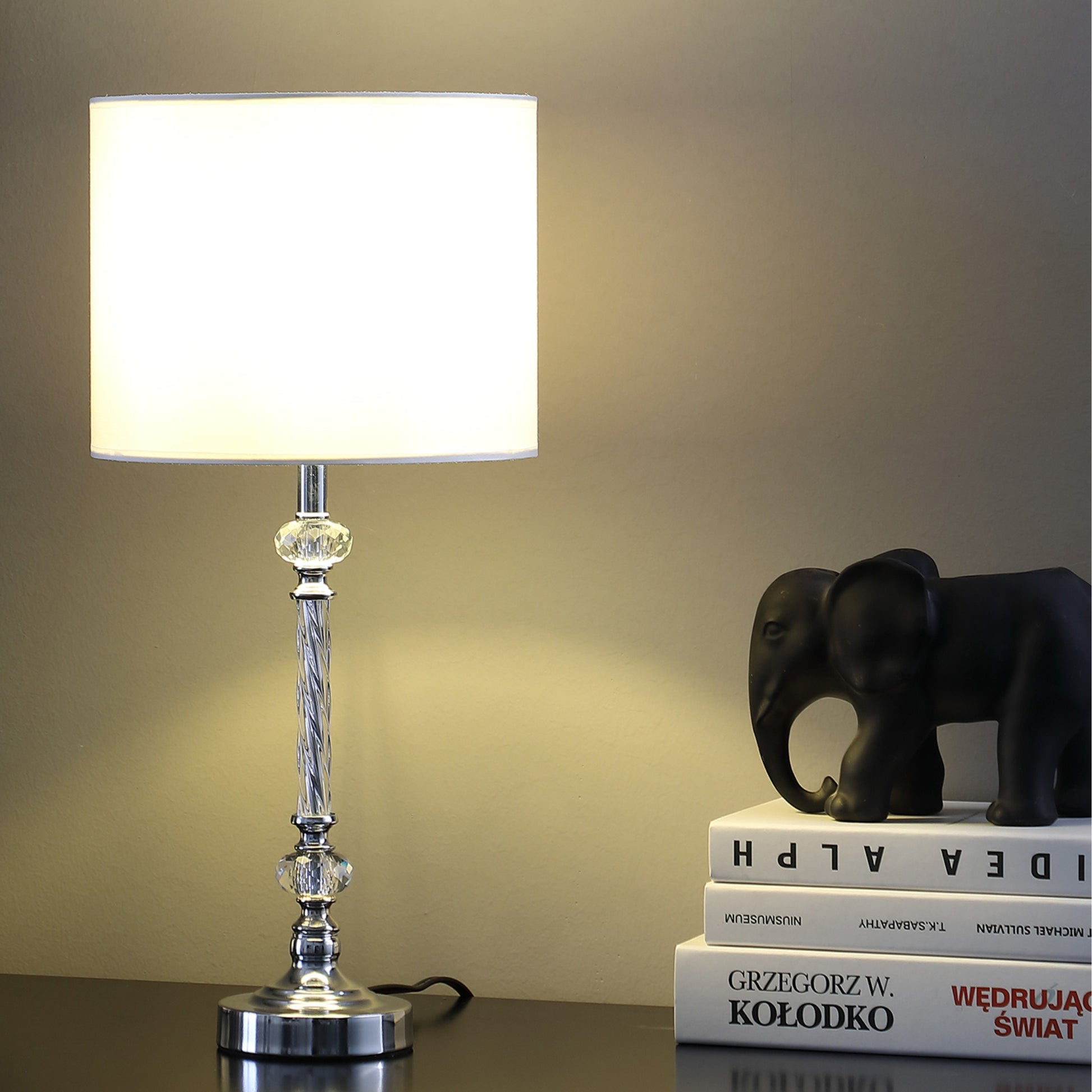 Modern chrome table lamp with crystal accents and white drum shade
