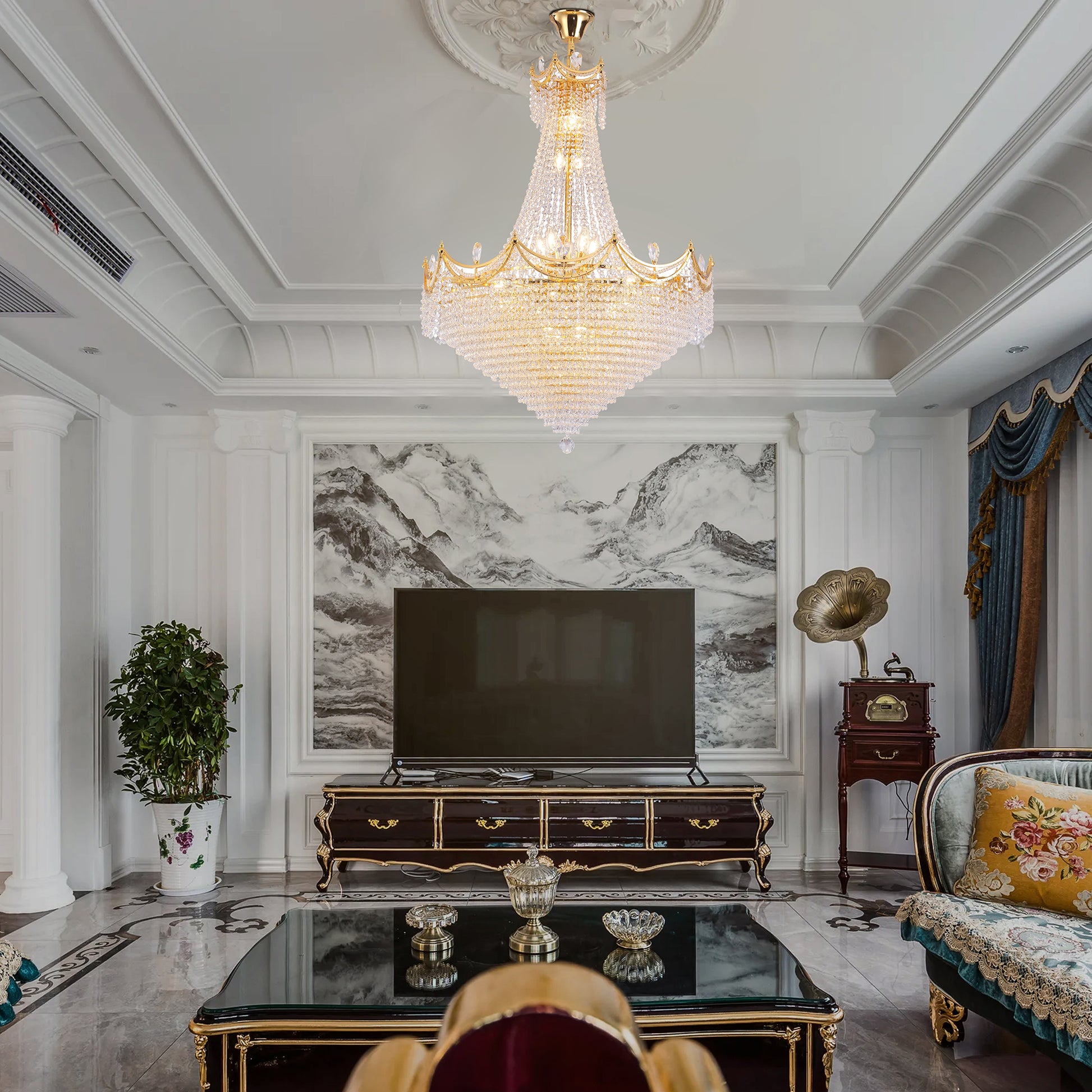 Grand gold crystal chandelier with cascading diamondlike prisms and ornate crown design