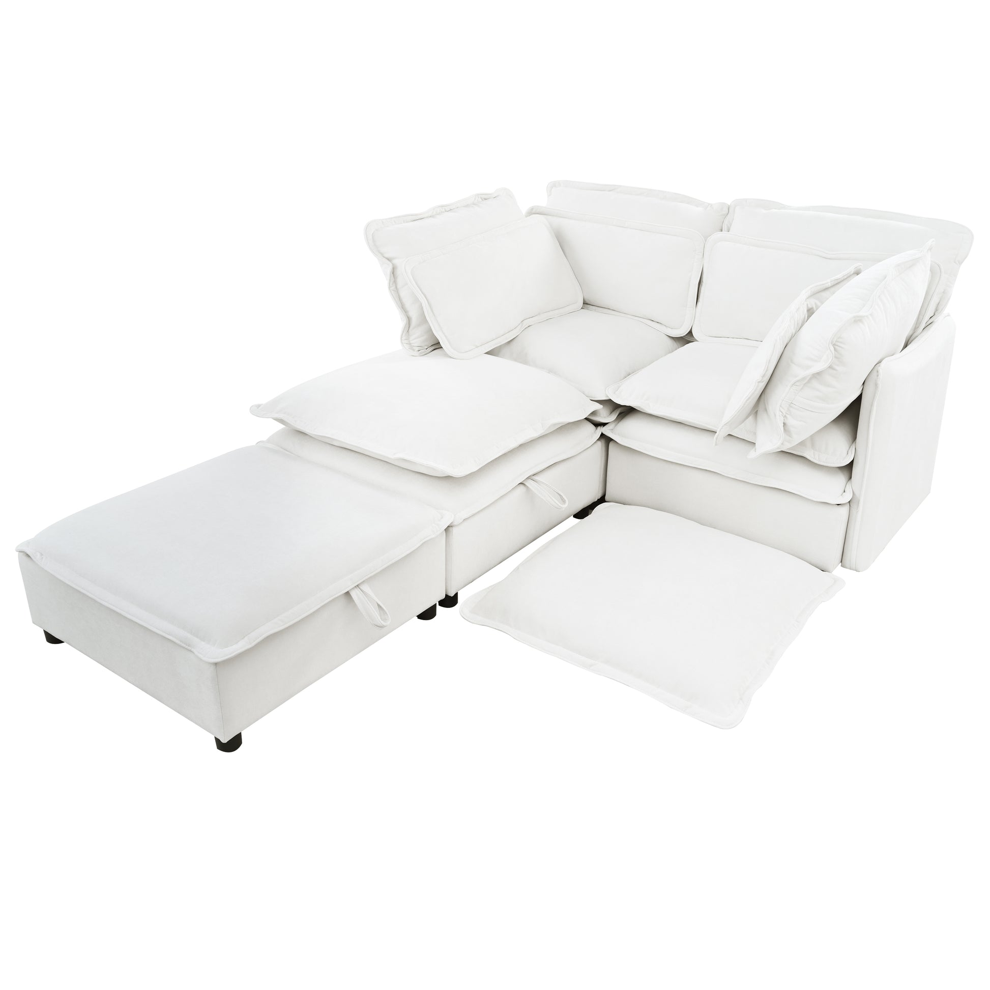 White modular sectional sofa with plush cushions and a storage ottoman