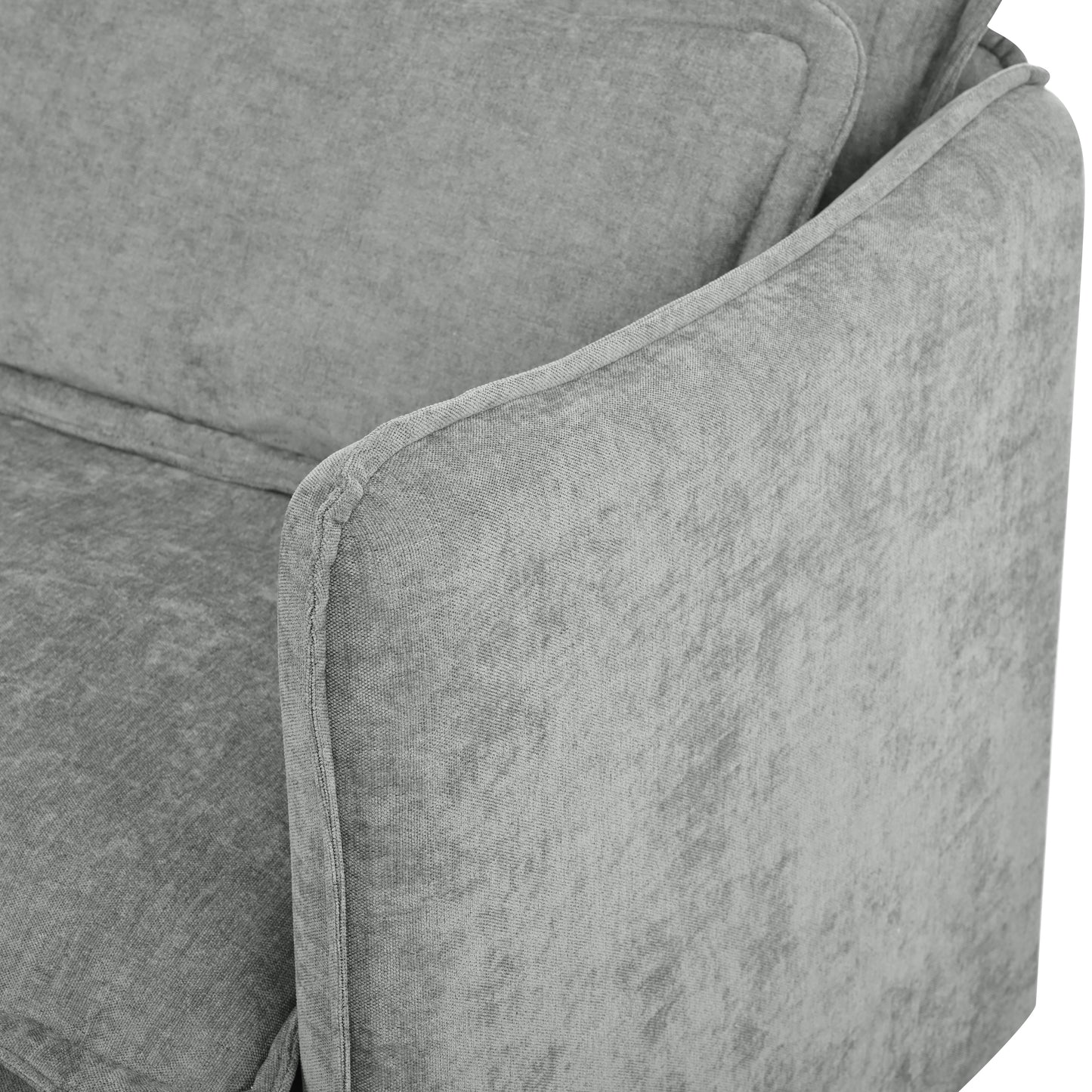 Closeup of a textured grey fabric sofa armrest showing woven detail