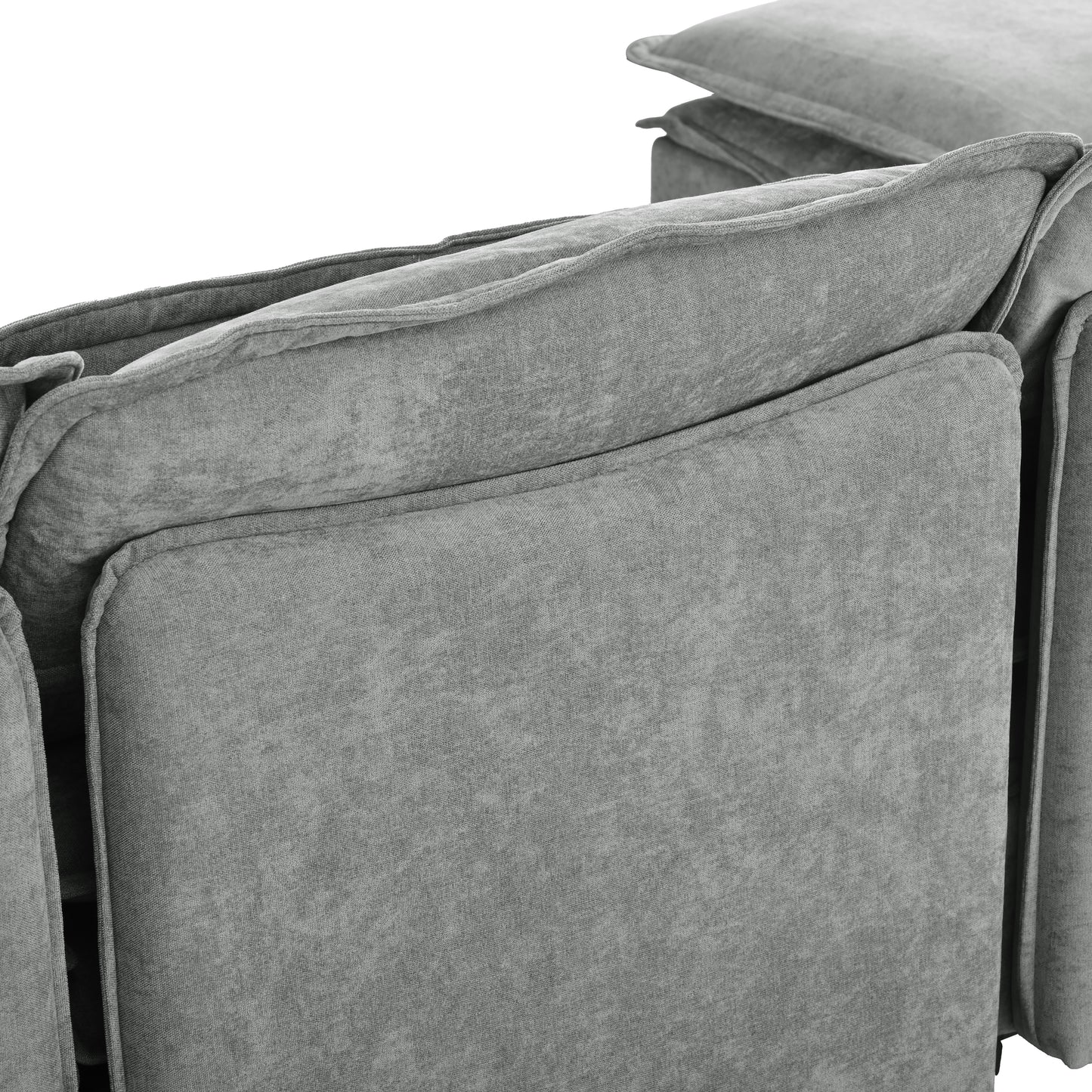 Closeup of plush grey fabric sofa with tufted back cushions for comfortable seating