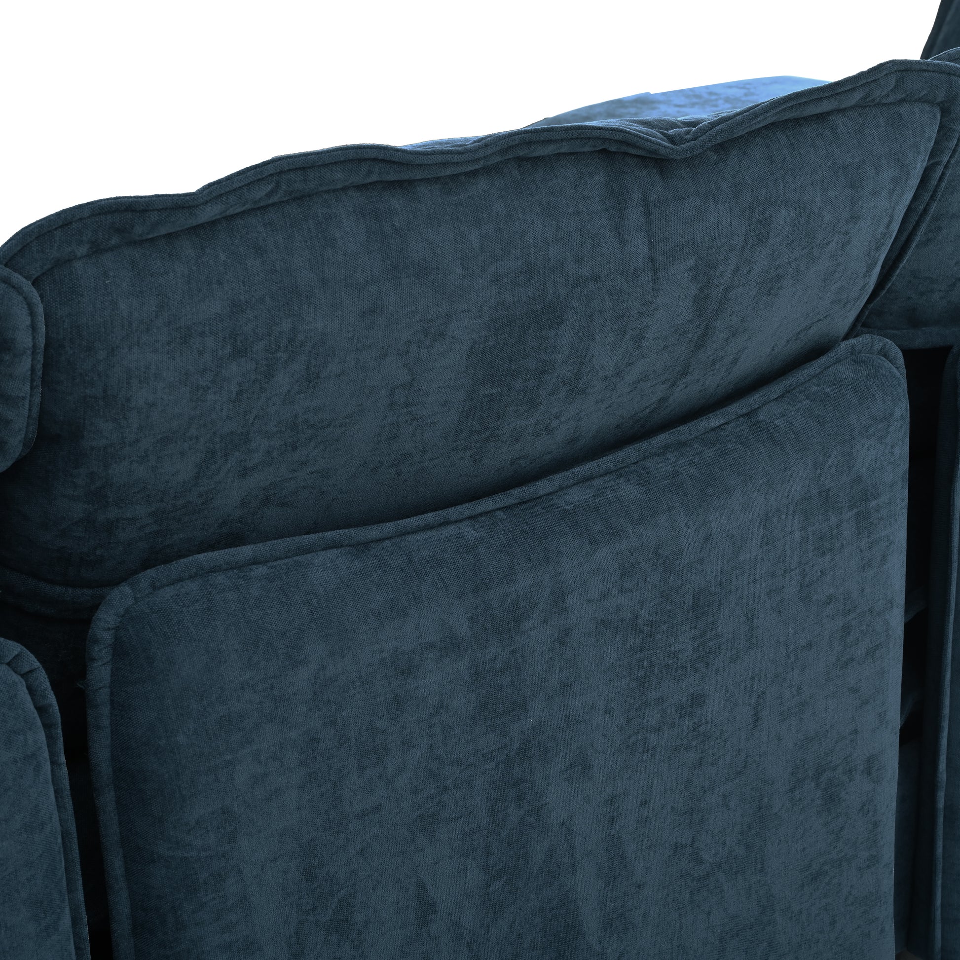 Closeup of plush textured dark blue velvet sofa cushions with detailed stitching for comfort