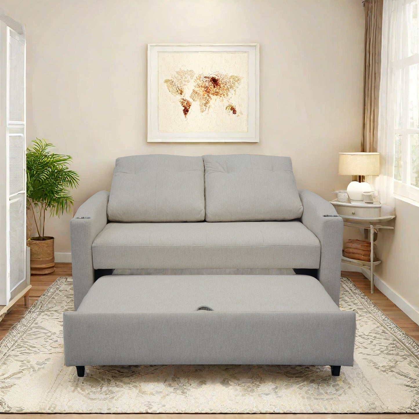 Light gray upholstered sofa with a pullout bed ideal for small spaces