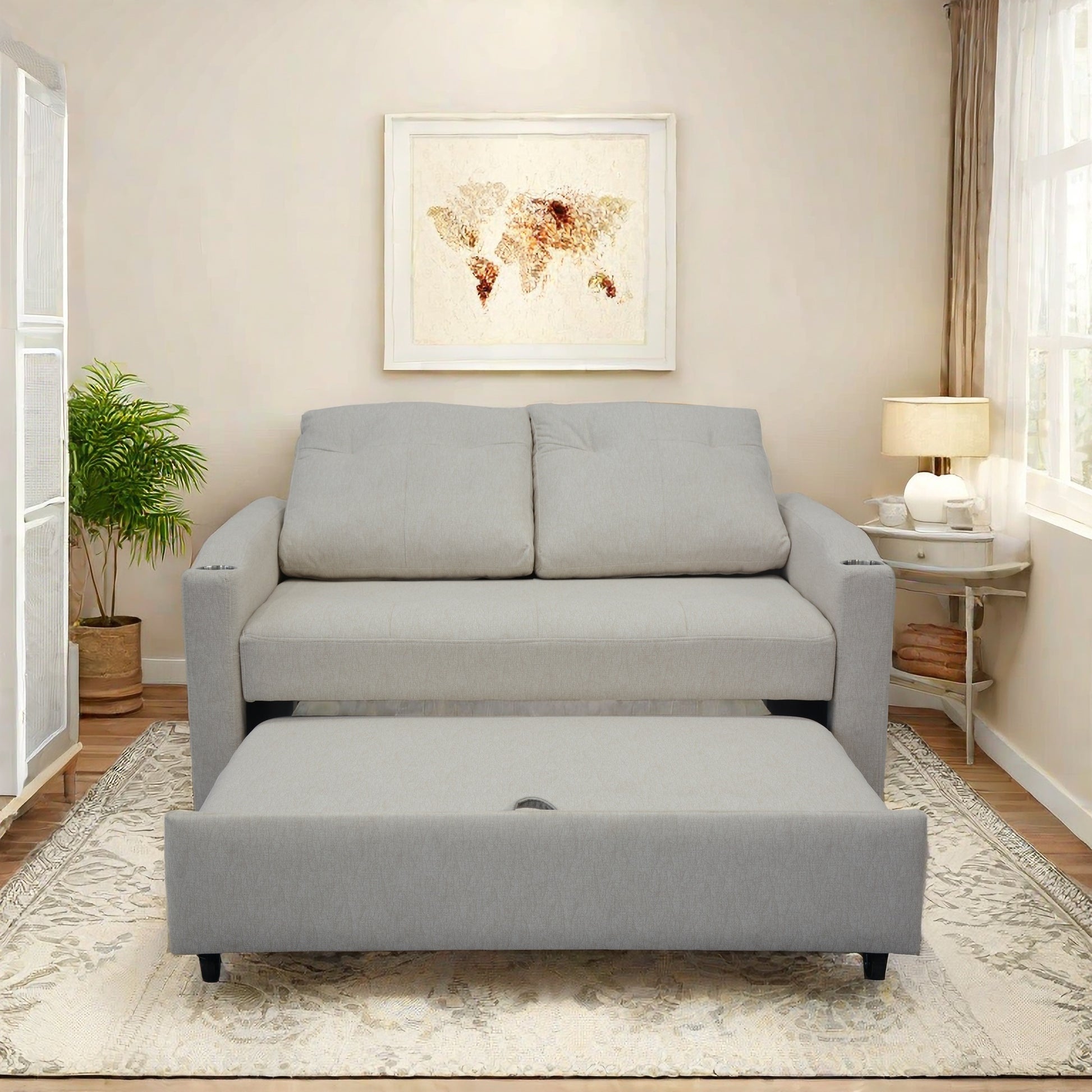 Light gray upholstered sofa with a pullout bed ideal for small spaces