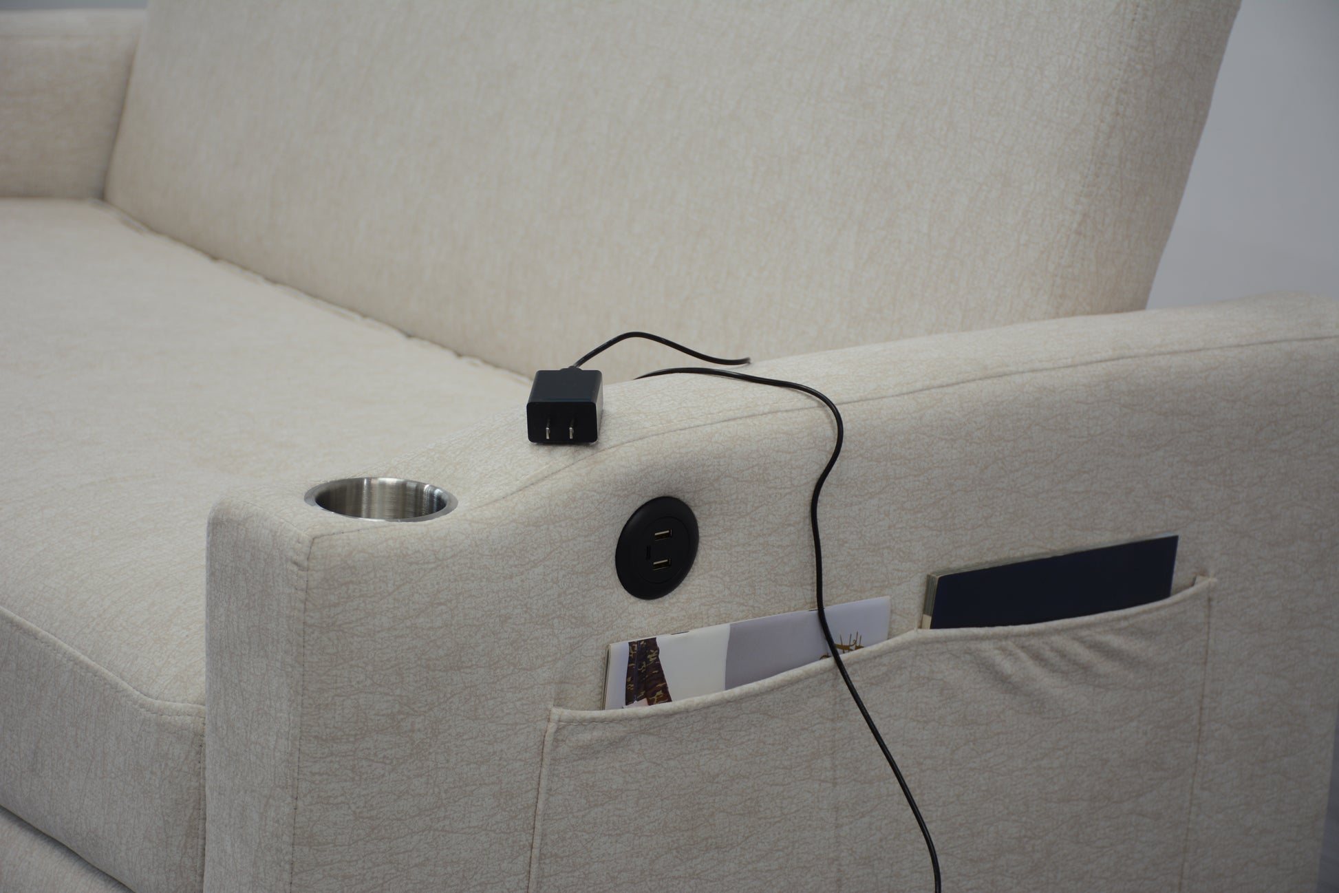 Beige fabric recliner with builtin cup holder USB ports and power adapter