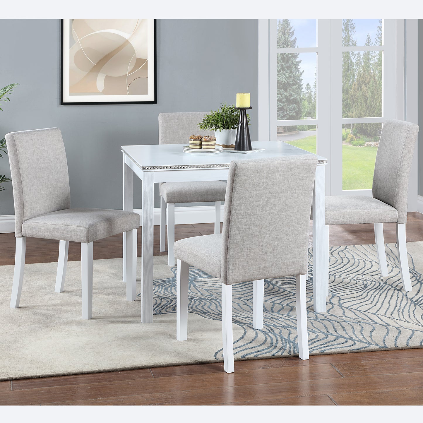 Four upholstered dining chairs around a white table