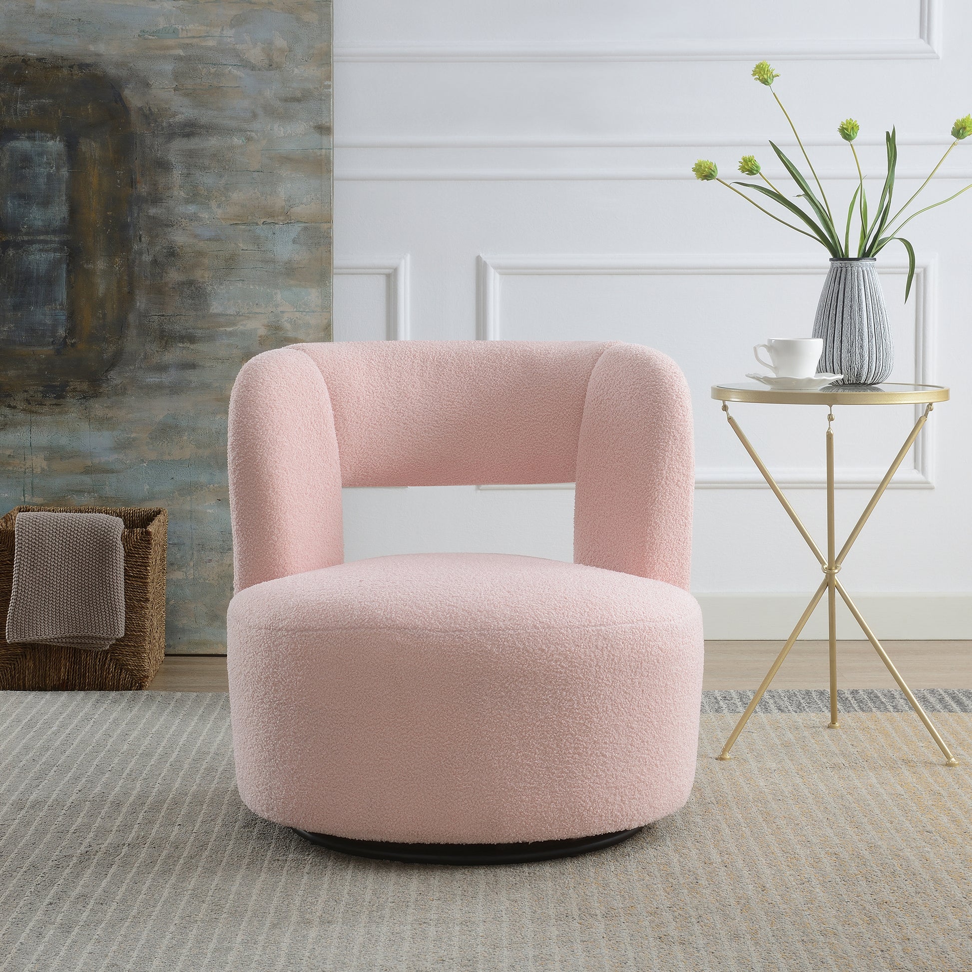 Plush pink boucle accent chair with curved back for a cozy reading nook