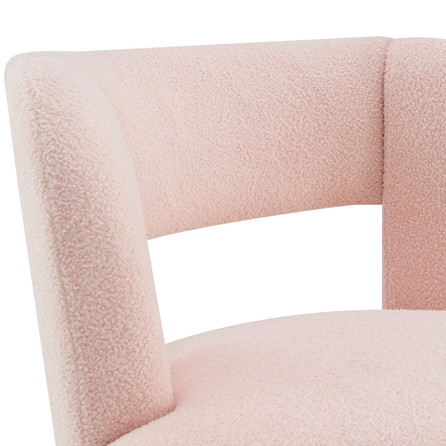 Closeup of a blush pink boucl accent chair with a curved back and seat