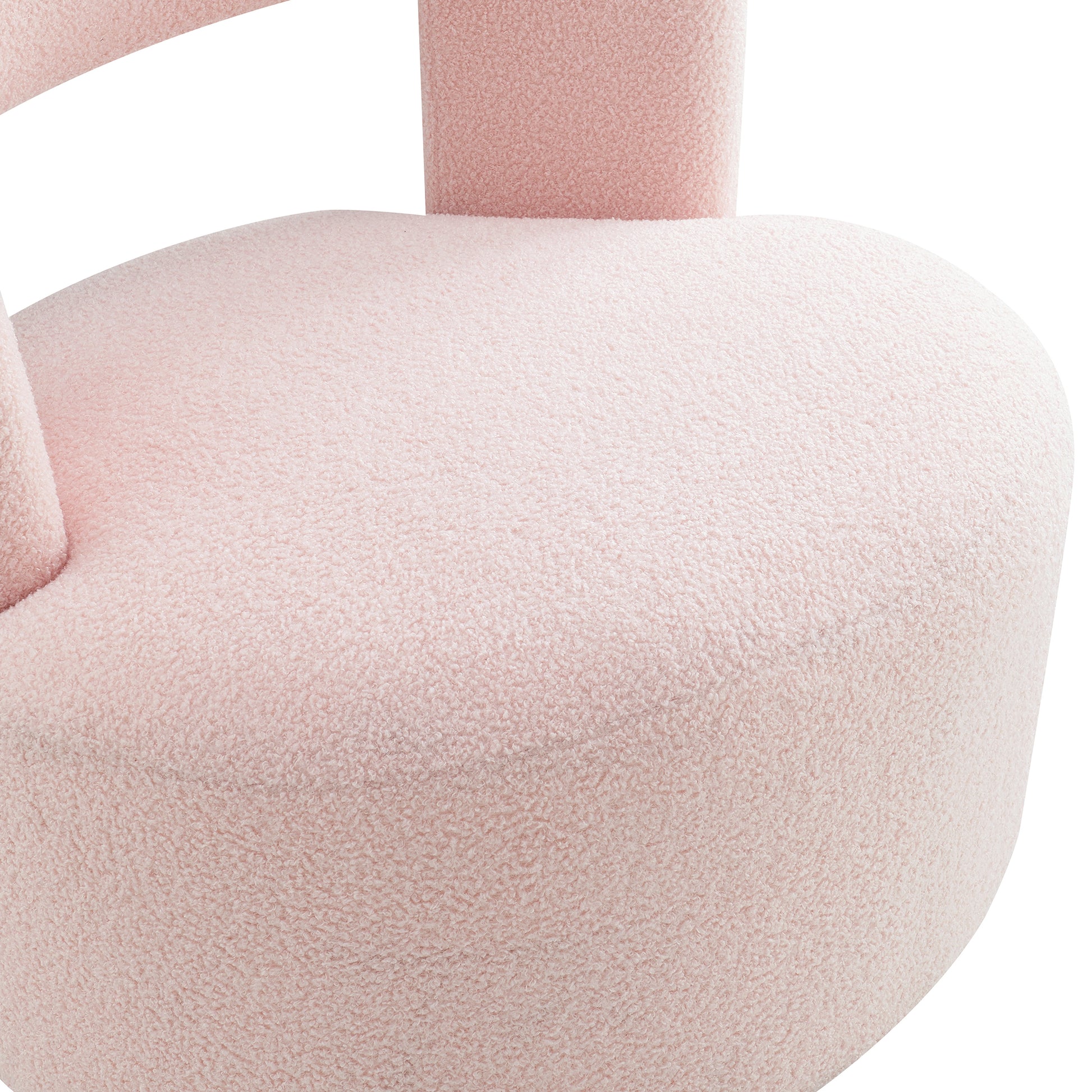 Close up of a plush pink boucle accent chair seat a stylish statement furniture piece