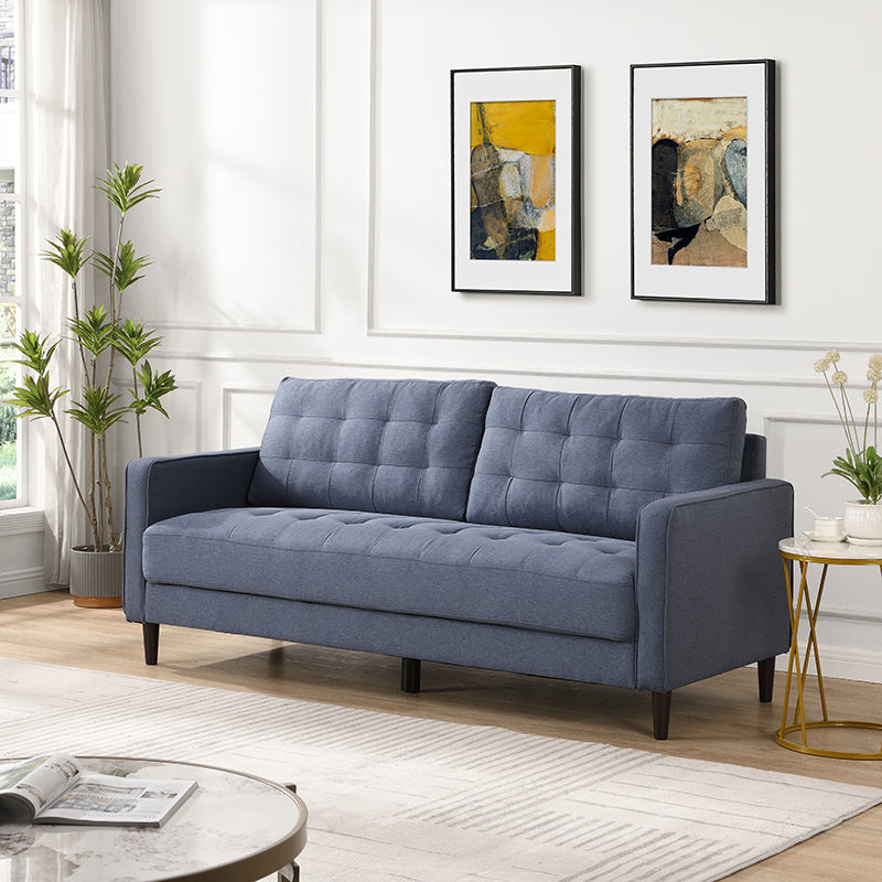Blue fabric sofa with tufted cushions and dark wood legs modern design for living rooms