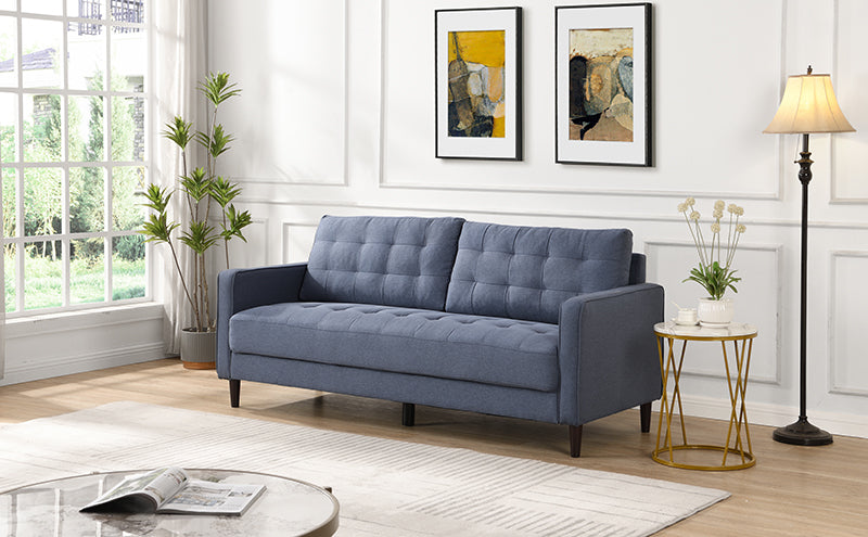 Blue tufted sofa with wooden legs perfect for a modern living room