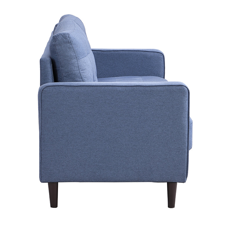 Side view of a blue fabric sofa with tufted cushions and dark wooden legs