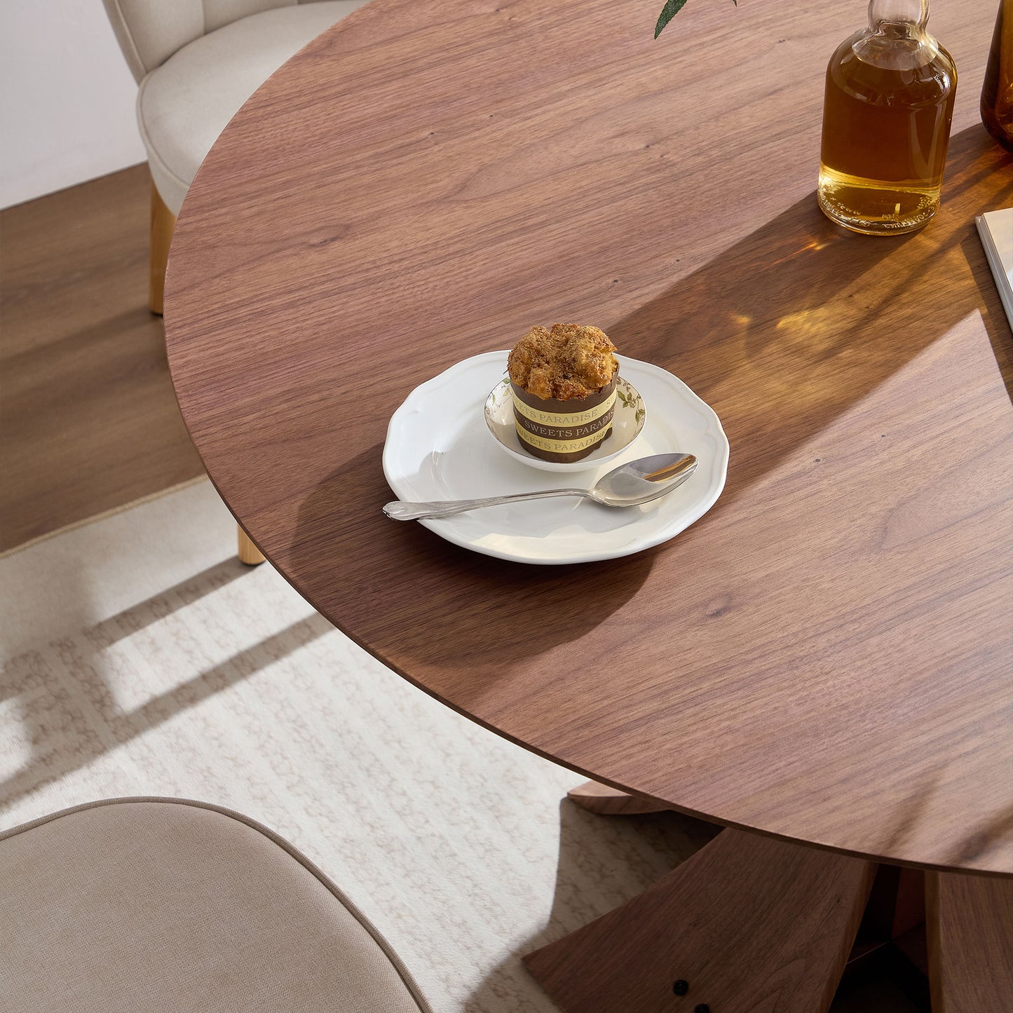 Solid walnut round dining table with natural wood grain showcasing minimalist design