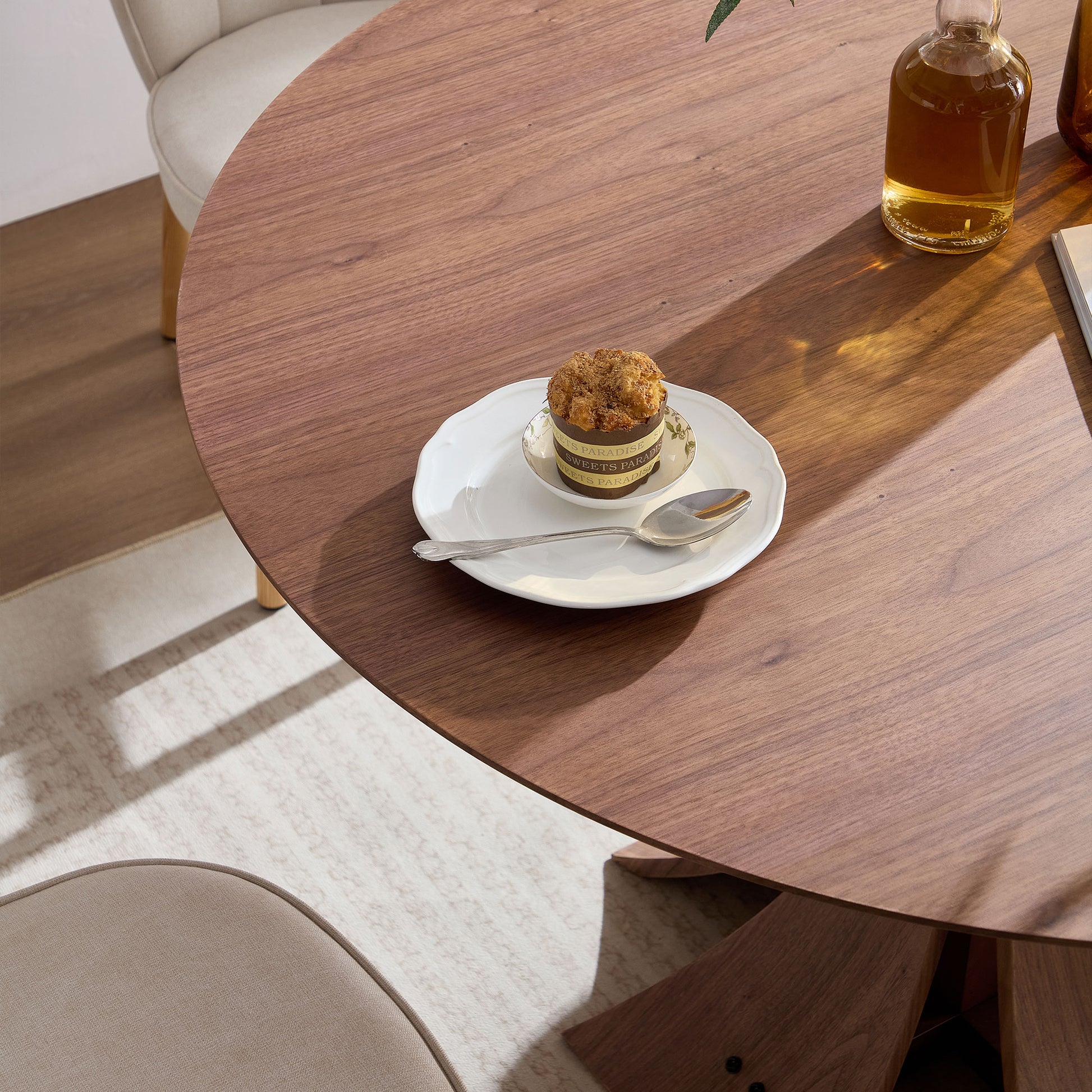 Solid walnut round dining table with natural wood grain showcasing minimalist design