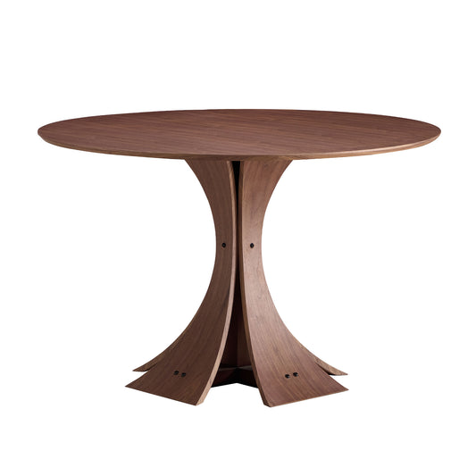 Round walnut dining table with sculptural pedestal base