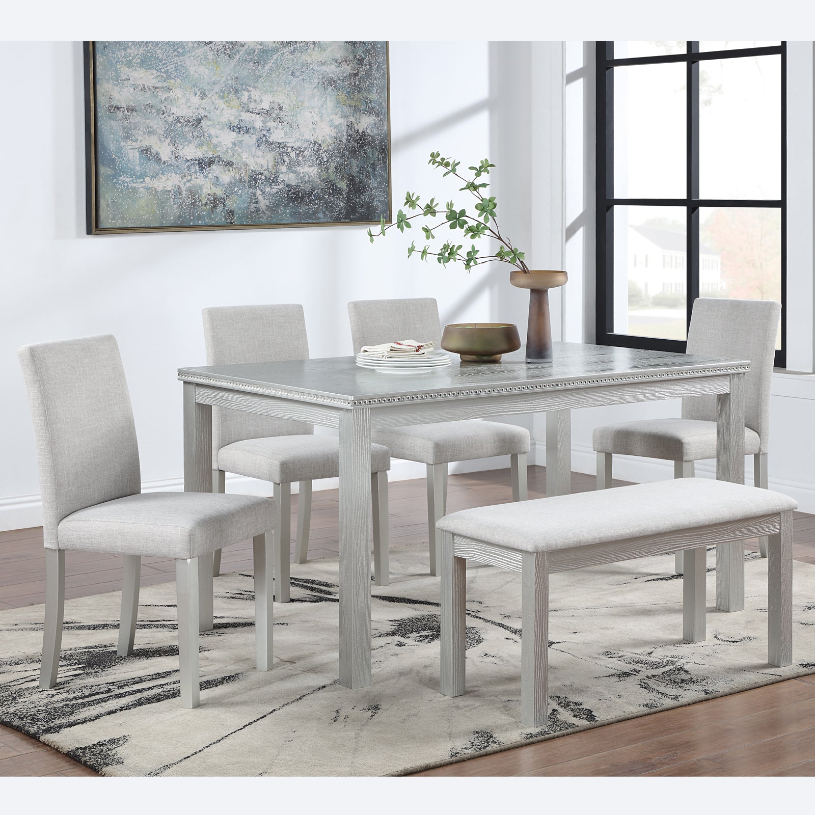 Gray linen upholstered dining chairs with light wood finish legs