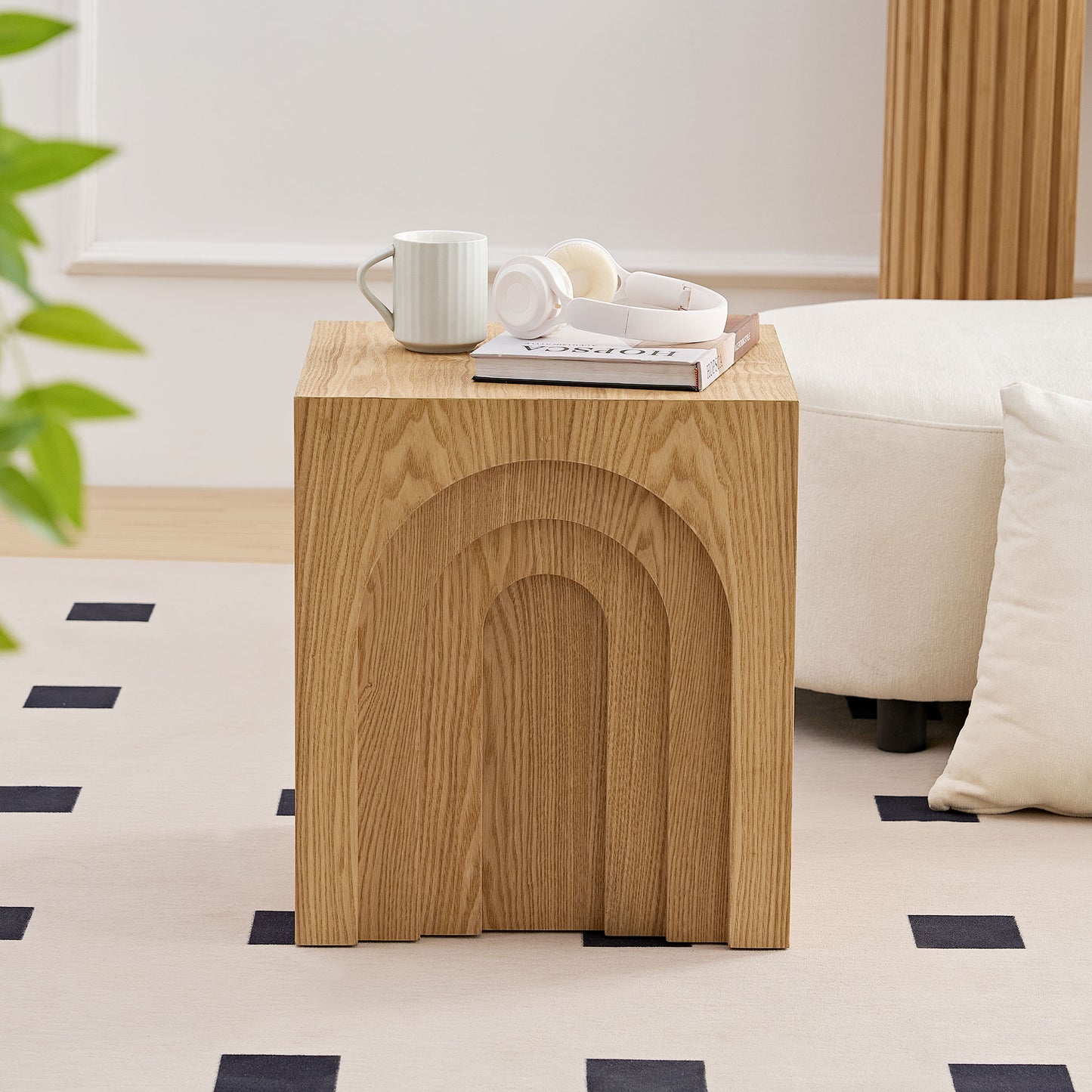 Wooden side table with carved arch design perfect for modern living room decor