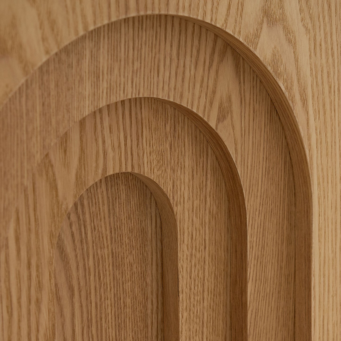 Textured natural oak wood paneling with layered arch design detail for modern interiors