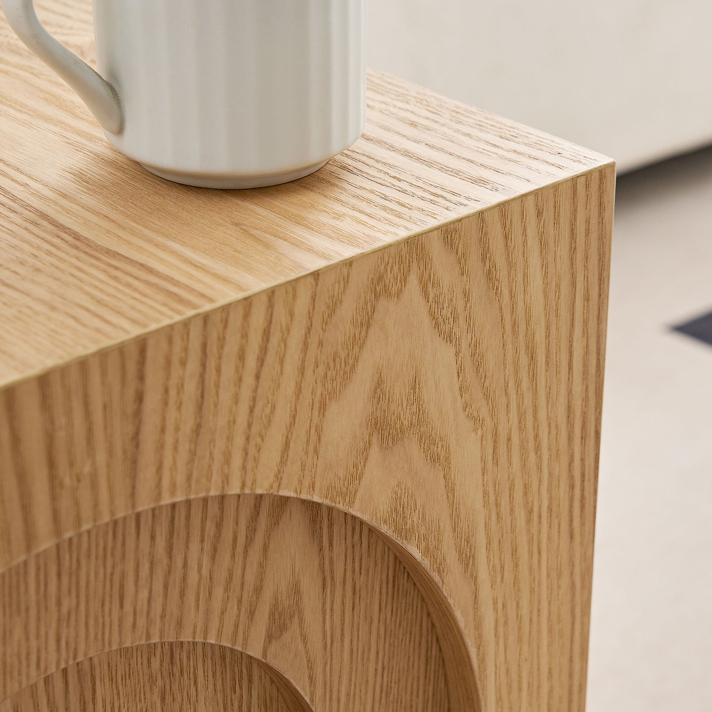 Natural oak wood side table with subtle carved arcs ideal for modern homes